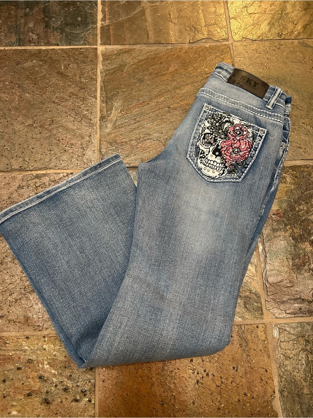 Sky Light Blue Jeans with Embroidered Skull Pocket and Crystals, Size 9/10.